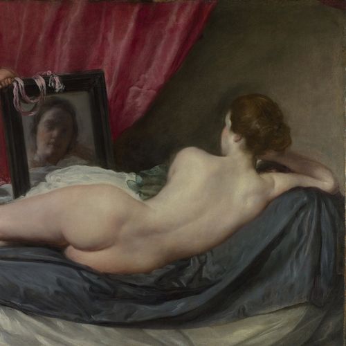 Vénus nue, allongée sur le côté, vue de dos, devant un miroir qui reflète son visage.